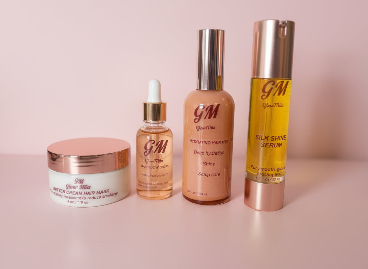 Set of GM hair care products including a cream, serum, and oil on a neutral background